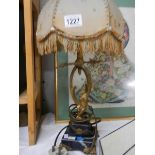 An ormolu gilt cherub table lamp.