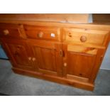 A late 20th century pine dresser base.