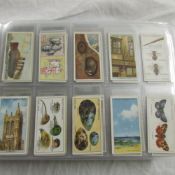 An album of cigarette cards including Wills etc