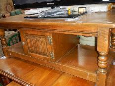 An oak cottage style coffee table.