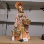 A 1950's ceramic figure in pastel shades, approximately 14" tall.