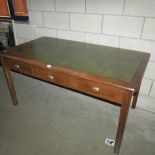 A leather topped 3 drawer office desk.