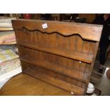 A dark wood stained pine wall mounted set of shelves