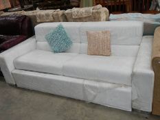 A large white leather bed settee.