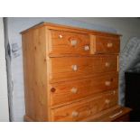 A pine 2 over 3 chest of drawers.