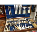 An oak cased canteen of cutlery.