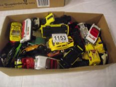 Box containing various die-cast toys