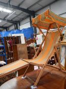 An old retro deck chair with canopy.