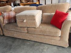 A large 3 seater sofa and stool.