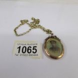 An early 20th century first world war period sweetheart locket of an young man in officer's uniform,