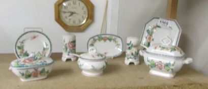 3 miniature Portuguese pottery tureens, 3 small plates and salt and pepper pots.