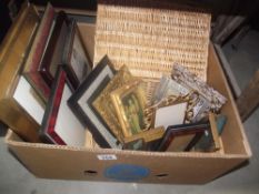 A box containing a wicker basket and quantity of picture frames etc.