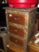 A shabby chic chest of drawers with pine front