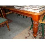A large Victorian wind out table with handle.