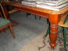 A large Victorian wind out table with handle.