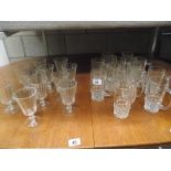 A dozen vintage 1/2 pint beer glasses and 10 wine glasses