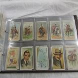 An album of cigarette cards including Wills,