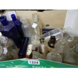 A mixed lot of old glass chemist's bottles.