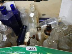 A mixed lot of old glass chemist's bottles.