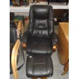 A leather effect executive rotating armchair with foot stool (slight wear to arms)
