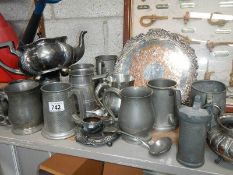 A large mixed lot of pewter items.