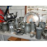 A large mixed lot of pewter items.