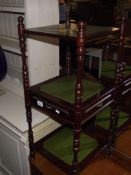 A darkwood stained 3 tier What Not / side unit with green leather panels