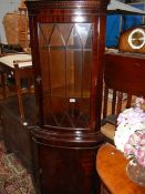 A mahogany corner unit.