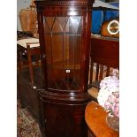 A mahogany corner unit.