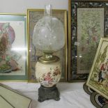 A Victorian pottery and brass oil lamp.