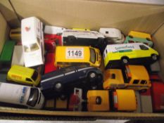 Box of die-cast toy vans