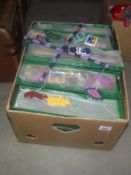 A large quantity of new boxed wooden childrens mobiles