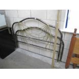 A chrome and brass coloured metal bed frame