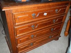 An oak 4 drawer chest.