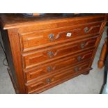 An oak 4 drawer chest.