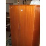 A 1970s teak veneered double wardrobe