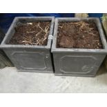 A pair of square garden pots.