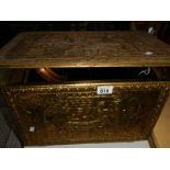 A brass log box and a warming pan.