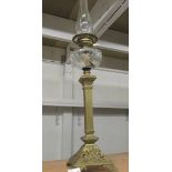 A Victorian brass column oil lamp with cut glass font.