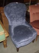A blue upholstered nursing chair