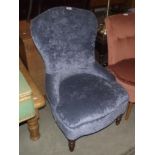 A blue upholstered nursing chair