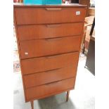 A 6 drawer teak chest.