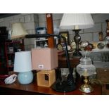 A quantity of electric table lamps.