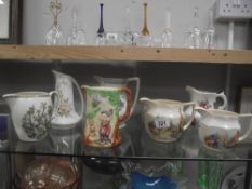 A quantity of pottery jugs including Wade Heath (Snow White)