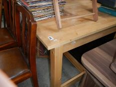 A large pine kitchen table.