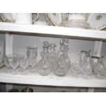 A collection of glassware including wine glasses, decanters, vases & bowls etc.