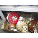 A box of various clocks/barometers