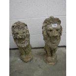 A pair of lion newel post tops, 21".