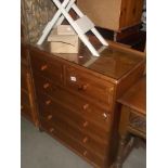A solid pine bedroom chest of drawers with glass top