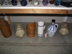 A quantity of stoneware and hot water bottles etc